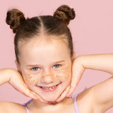 Party Glitter Freckles on the Cheeks of your girl. Close up