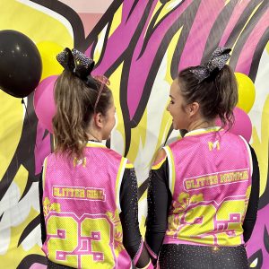 Glitter Girl Founder Sophia Rizzo and her Mother Megan Competing Together in World DC Cheerleading Games in Hawaii - A Journey of Triumph and Inspiration! After Megan was diagnosed with Breast Cancer in 2019, she never dreamed of days like these.