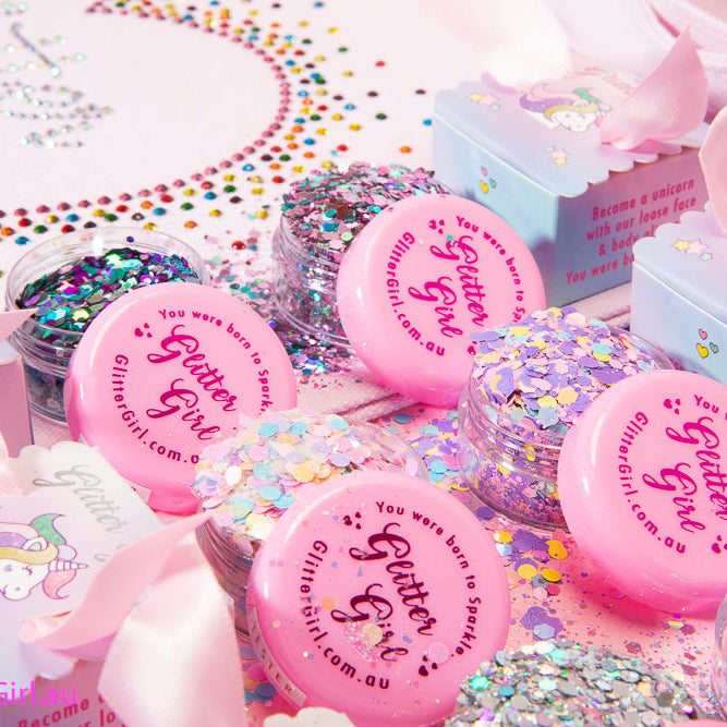 Various containers of chunky hair glitters with different colours displayed 