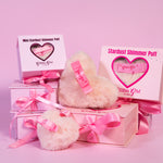 Full-size bronze Stardust Love Heart Shimmer Puff beside the travel-sized baby pink Mini