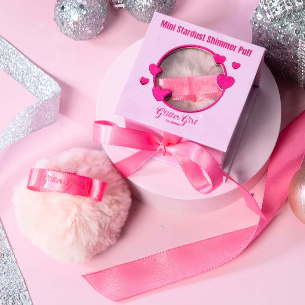 Glitter Girl Mini Stardust Shimmer Puff with rose gold body shimmer