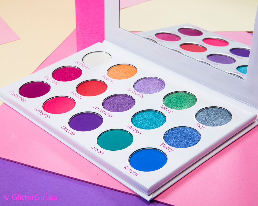 Close up of Vegan & Cruelty-Free Glitter Eyeshadow Palette – high-pigment rainbow hues with soft, fluffy makeup brushes for flawless application.